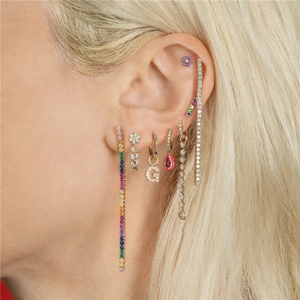 Close-up of S925 silver flower stud earring and colorful zircon hoop set on model ear