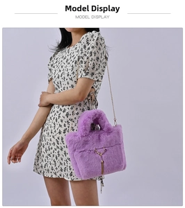 Detail of light purple faux rabbit fur bag featuring golden deer head hardware and tassel