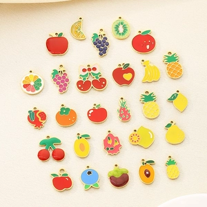Detailed assortment of colorful enamel fruit charms including apple and cherry designs