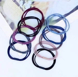 Macro detail of elastic hair tie set with triple-strand design and matching connectors