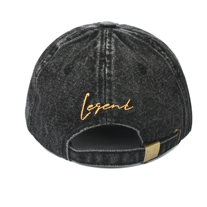 Rear view of vintage washed denim baseball cap with orange Legend embroidery and metal buckle