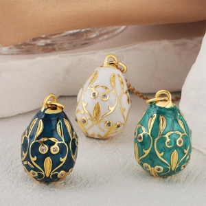 Enamel egg pendants in blue, white and green with gold plating and rhinestones