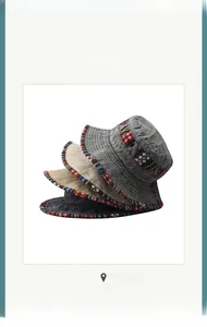 Detailed embroidery on foldable washed cotton bucket hats in grey, beige, and black