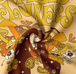 Detail of retro 70s pop art fabric showing soft texture with mushroom and floral prints