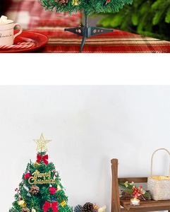 Detailed view of a 50cm tabletop Christmas tree with festive ornaments and red bow tie
