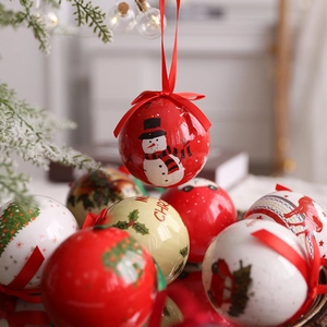 Festive Christmas ball ornaments with reindeer and snowman prints hanging on a tree