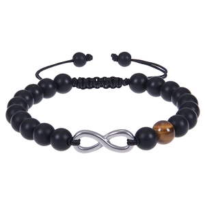 Detail of beaded infinity bracelet with matte black stones and a tiger eye bead accent