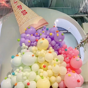 Creative ice cream shape arrangement of macaron pastel balloons for party decoration