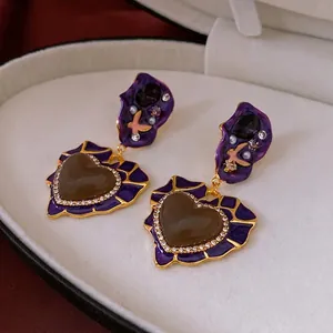 Vintage gold heart earrings with purple enamel, brown gems and sparkling white crystals