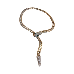Exaggerated golden snake necklace with sparkling crystals and a chunky cuban chain