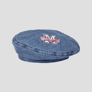 Close-up of M Madrid embroidery on washed blue denim beret with flat top design