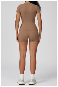 Back view of high-stretch brown yoga set with slim-fit tee and high-waist sports shorts