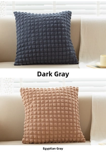 Detailed close-up of textured seersucker cushion covers in dark gray and egyptian gray