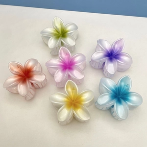 Set of six colorful plumeria flower hair claws with a glossy pearlescent finish
