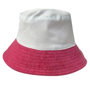Detailed close-up showing white fabric crown and pink terry cloth brim on bucket hat