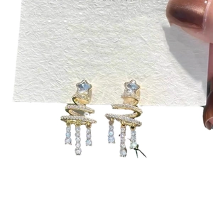 Elegant gold Christmas tree earrings with sparkling stars and crystal tassels