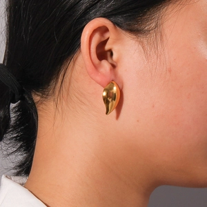Minimalist gold leaf water drop earrings for women shown on model for elegant daily style