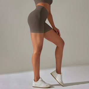 Seamless high-waisted yoga shorts with peach lift effect in warm mocha brown