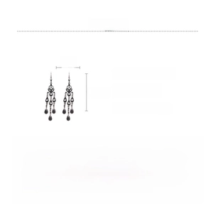 Macro view of gothic black teardrop tassel earrings with intricate hollow design and crystals