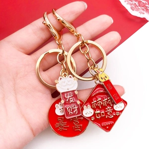 Chinese style red enamel lucky charms with Maneki Neko and golden fortune pendants