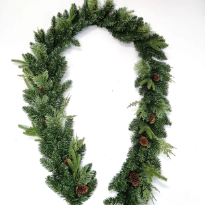 Artificial Christmas garland with green pine needles and natural pine cones for decor
