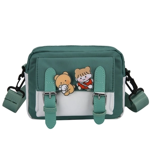 Cute green and white nylon crossbody messenger bag with cartoon charms and double straps
