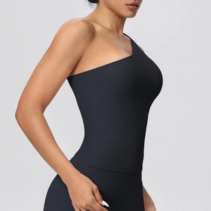 Detail of black one-shoulder sports bra showing high-elasticity fabric and slim fit design
