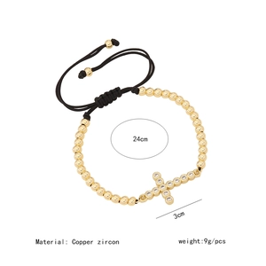 Detailed view of 18K gold beaded cross bracelet with dimensions and 9g weight info