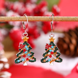 Colorful rhinestone Christmas tree earrings with gold star and red bow on wood