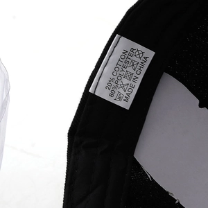 Detail view of the care label showing 20% cotton and 80% polyester material composition