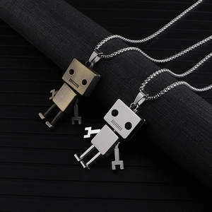 Detailed view of bronze and silver robot pendants with movable limbs on metal chains