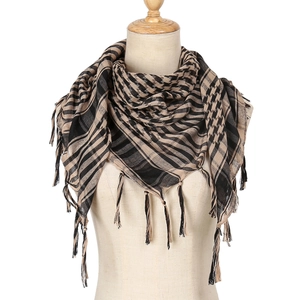 Detail of houndstooth desert tactical scarf with fringe tassels on mannequin