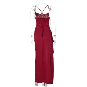Detail view of red satin evening dress featuring a cross-back lace-up design and open back