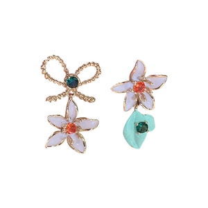 Asymmetric floral bow earrings with lilac and mint enamel and gold plated accents