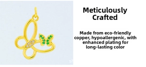 Detail of eco-friendly copper butterfly pendant with green zircon and gold plating