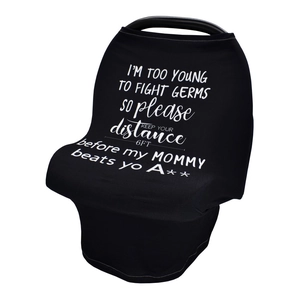 Detail of black car seat cover with funny text print for baby germ protection