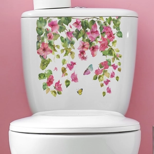 Detail of floral watercolor toilet sticker featuring pink flowers and green leaves