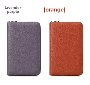 Detailed texture of genuine leather wallets in lavender purple and orange colors