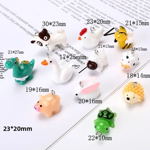 Detailed set of colorful resin animal charms including bees, turtles, and tiny dinosaurs