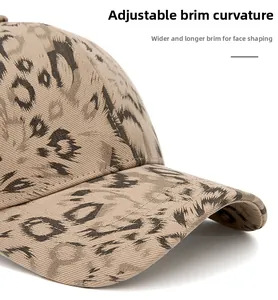 Detail of adjustable curved leopard print baseball cap brim designed to slim face shape