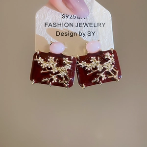 Detail of vintage square earrings with plum blossom motifs and S925 silver needles