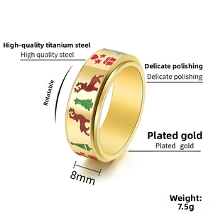 Detail view of 8mm spinning Christmas tree and reindeer ring in gold titanium steel