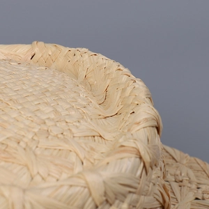 Classic straw boater hat made of natural raffia featuring a fine handmade woven texture