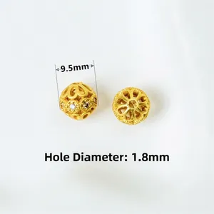 Detail of 9.5mm gold-plated beads with cubic zirconia and 1.8mm hole diameter