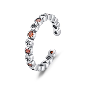 Bague ouverte en argent S925 avec étoiles en relief et pierres précieuses oranges