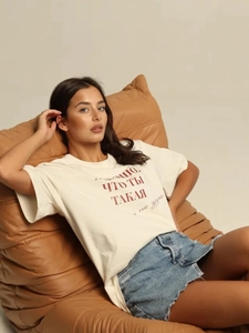 Relaxed white cotton T-shirt with red letter print paired with denim shorts
