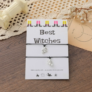 Detail of Best Witches charm bracelets with wizard charms on themed display card