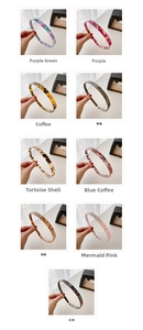 Macro display of slim acetate headbands with tortoiseshell and marble patterns