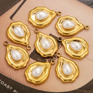 French vintage sunburst pearl pendants in gold finish arranged on a magazine