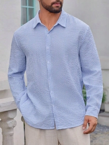 Detail of blue and white seersucker striped shirt fabric with breathable texture